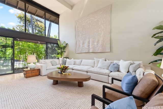 interior space featuring a high ceiling and beamed ceiling