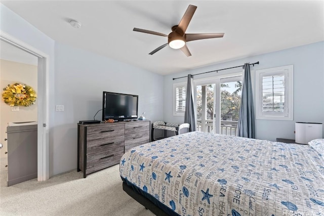 bedroom featuring multiple windows, light colored carpet, ceiling fan, and access to outside