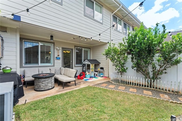 exterior space featuring fence and an outdoor fire pit