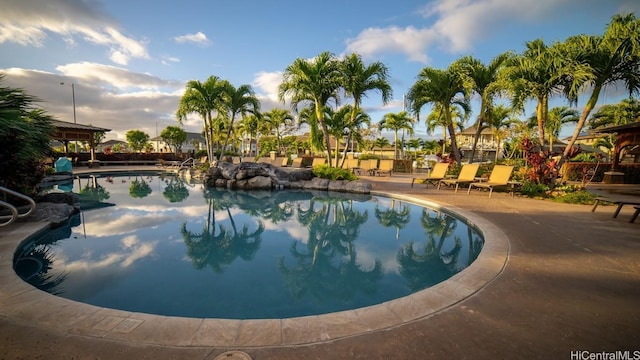 outdoor pool with a patio area