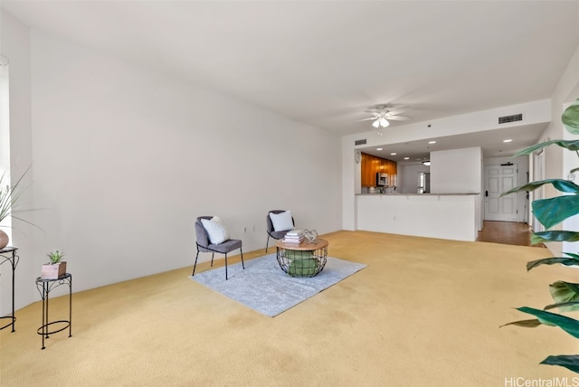 sitting room featuring recessed lighting, carpet, visible vents, and ceiling fan