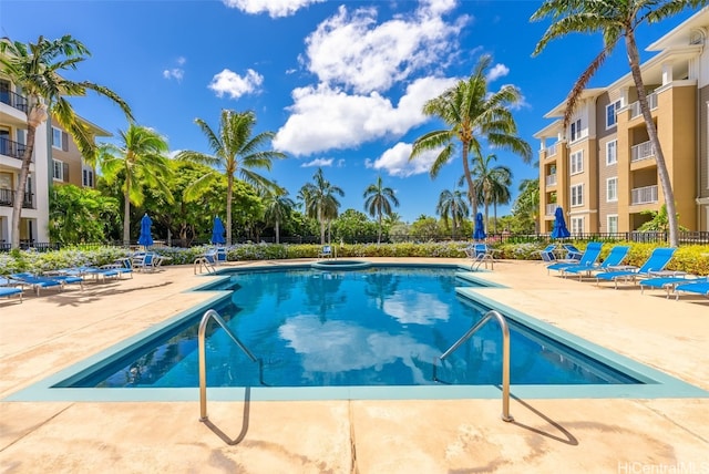 pool featuring a patio and fence