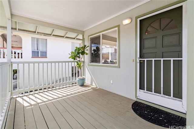 wooden terrace featuring covered porch