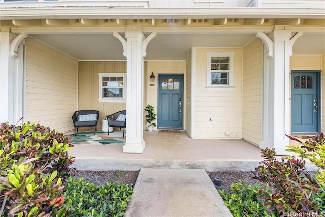 view of exterior entry featuring a porch