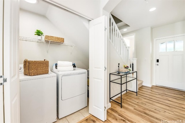 laundry room featuring recessed lighting, laundry area, independent washer and dryer, and wood finished floors