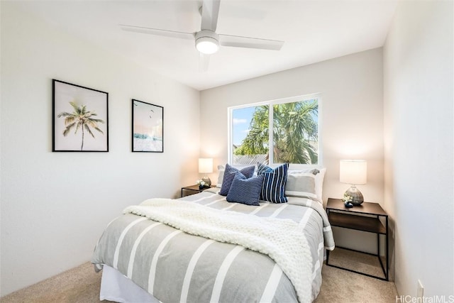 bedroom featuring light colored carpet and ceiling fan