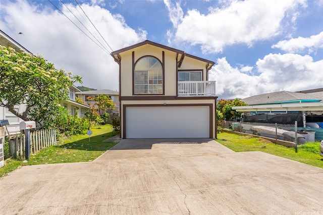 view of front of property with stucco siding, an attached garage, and driveway