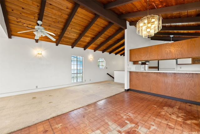 kitchen featuring wooden ceiling, beam ceiling, a ceiling fan, freestanding refrigerator, and a chandelier