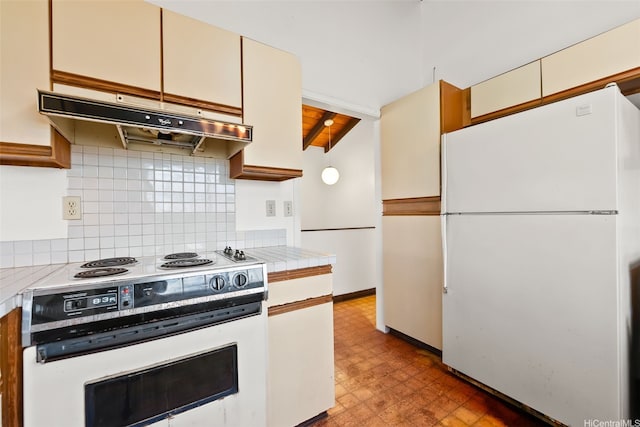 kitchen featuring white appliances, under cabinet range hood, light floors, decorative backsplash, and cream cabinets