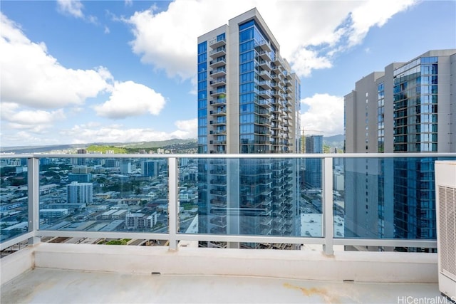 balcony with cooling unit and a city view