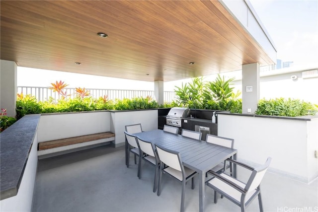 view of patio / terrace featuring outdoor dining space, a grill, and fence