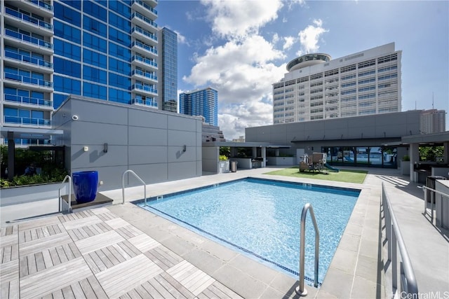 pool with a city view and a patio