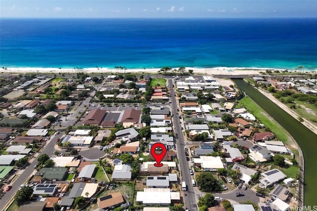 bird's eye view with a water view and a beach view