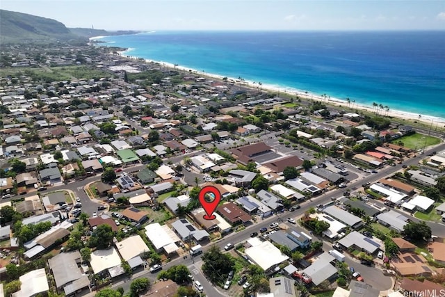 bird's eye view with a water view, a residential view, and a view of the beach