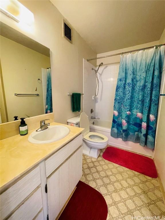 full bathroom featuring visible vents, toilet, shower / tub combo with curtain, tile patterned floors, and vanity