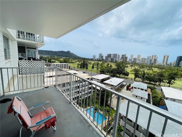 balcony with a view of city and a mountain view