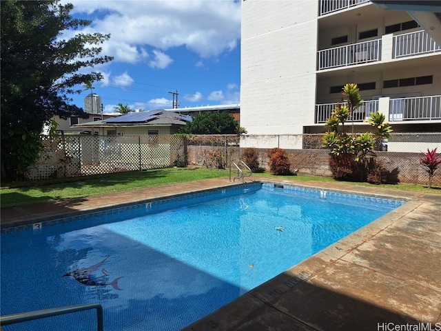 view of pool with fence