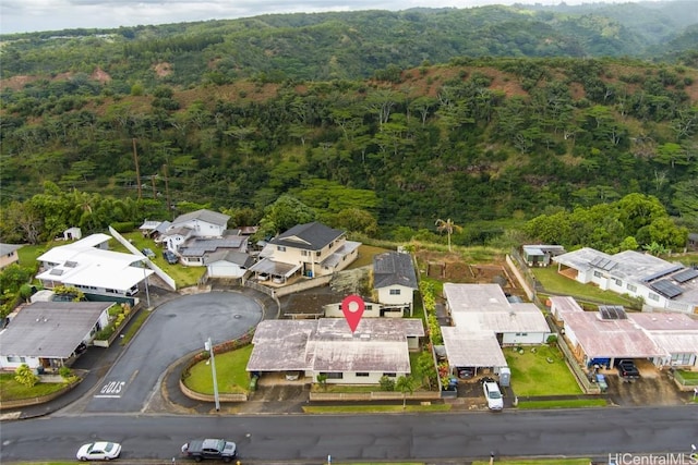 aerial view with a residential view and a view of trees