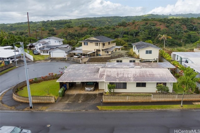 birds eye view of property featuring a forest view