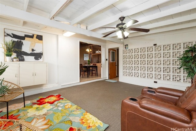 living room with carpet, beam ceiling, and ceiling fan