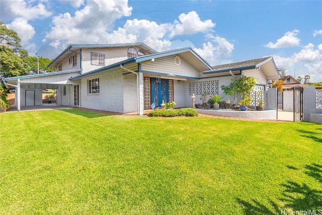 rear view of property with a lawn