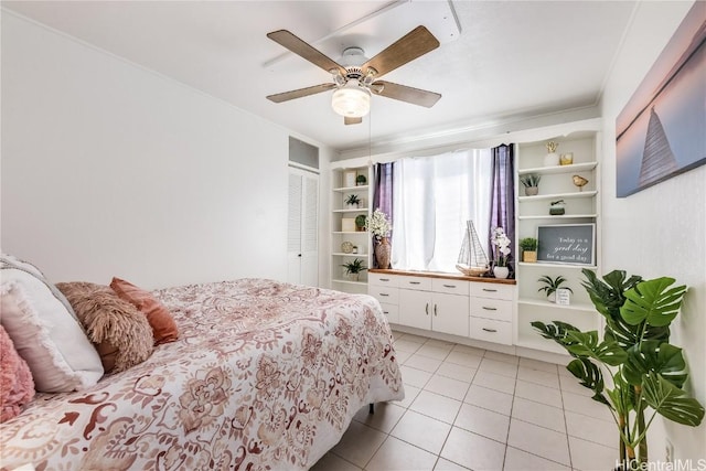 bedroom featuring ceiling fan and light tile patterned floors