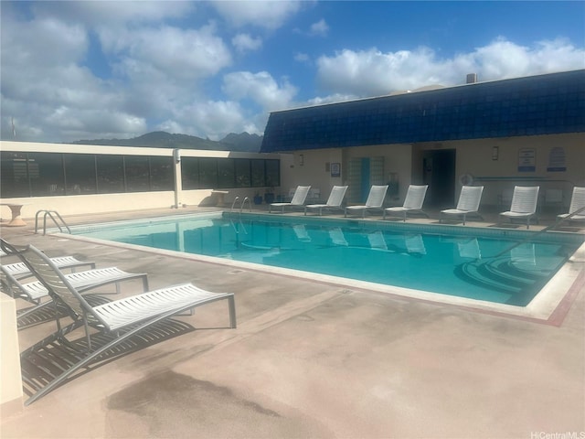pool with a patio area