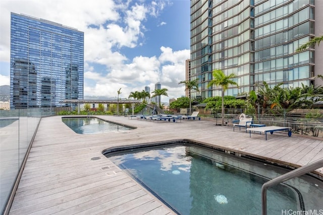 pool with a view of city and fence