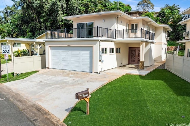 view of front facade featuring a front lawn, fence, a balcony, and stucco siding