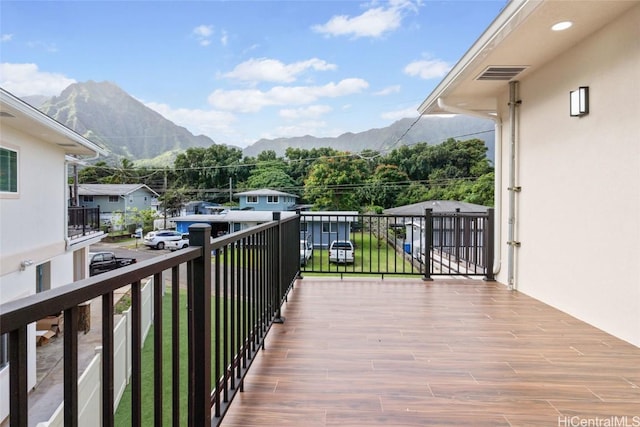 balcony featuring visible vents and a mountain view