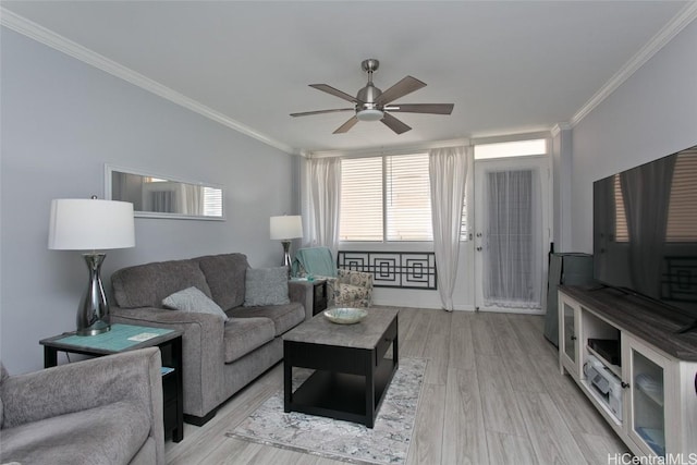 living area with light wood-type flooring, crown molding, and ceiling fan