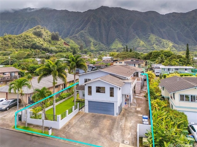 drone / aerial view featuring a residential view and a mountain view