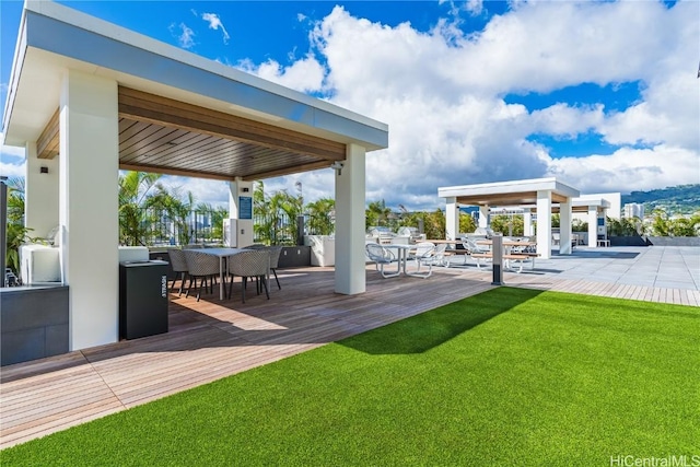 view of patio / terrace with a wooden deck and a gazebo