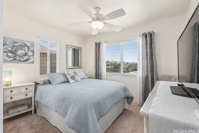 carpeted bedroom with a ceiling fan