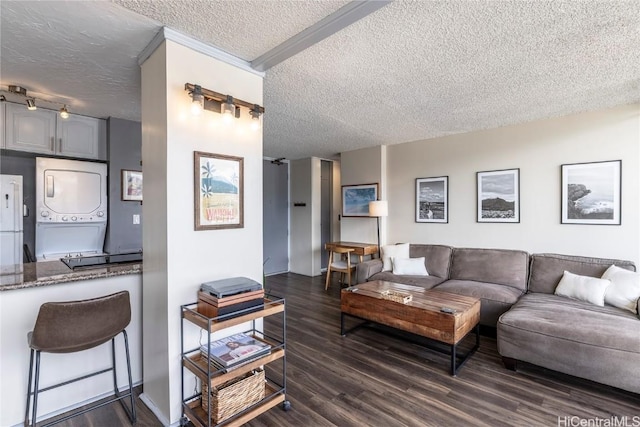 2121 Algaroba St Unit 1602, Honolulu, HI 96826 - living area featuring a textured ceiling, dark wood finished floors, and stacked washer / dryer