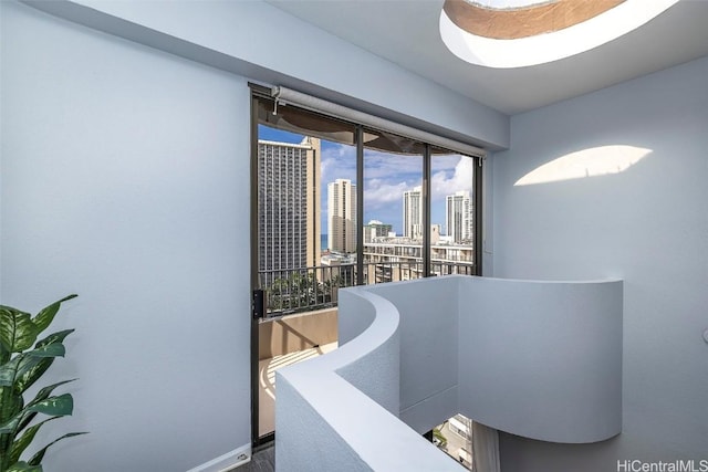 311 Ohua Ave Unit Ph D, Honolulu, HI 96815 - interior space with a city view and baseboards