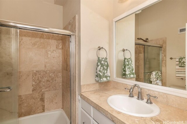 311 Ohua Ave Unit Ph D, Honolulu, HI 96815 - bathroom featuring a shower with door, visible vents, and vanity