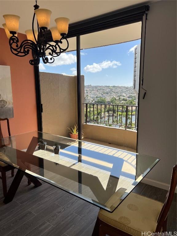 311 Ohua Ave Unit Ph D, Honolulu, HI 96815 - dining area with a notable chandelier and wood finished floors
