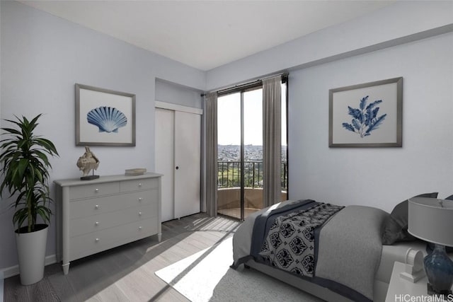 311 Ohua Ave Unit Ph D, Honolulu, HI 96815 - bedroom with a closet, access to exterior, and wood finished floors