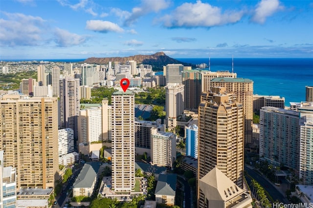 drone / aerial view featuring a view of city and a water view