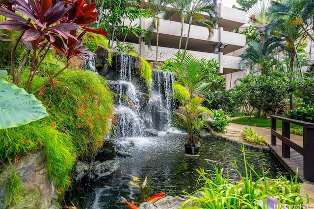 surrounding community featuring a small pond