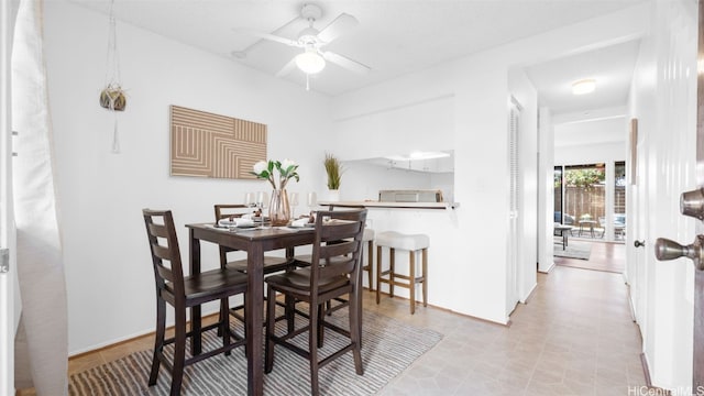 dining area with ceiling fan