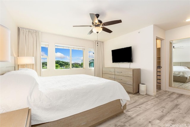 bedroom featuring wood finished floors and a ceiling fan