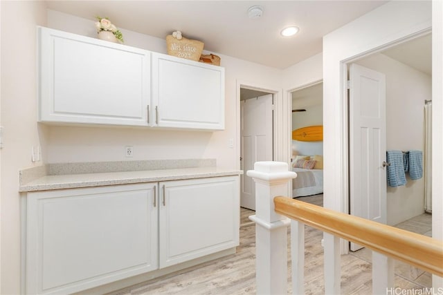 interior space featuring light wood-type flooring and recessed lighting