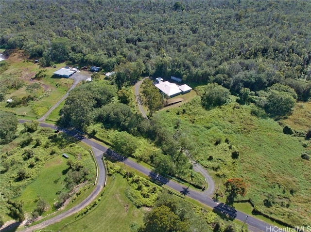 drone / aerial view featuring a view of trees