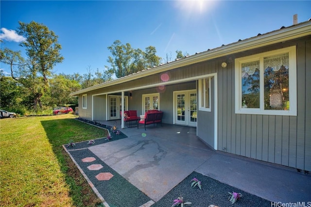 exterior space with a yard, french doors, and a patio area