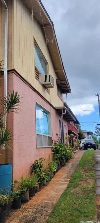 view of side of home featuring cooling unit