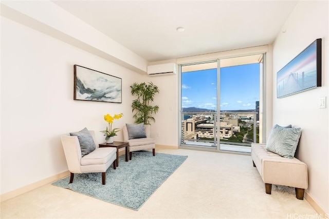 living area featuring expansive windows, an AC wall unit, carpet flooring, and baseboards