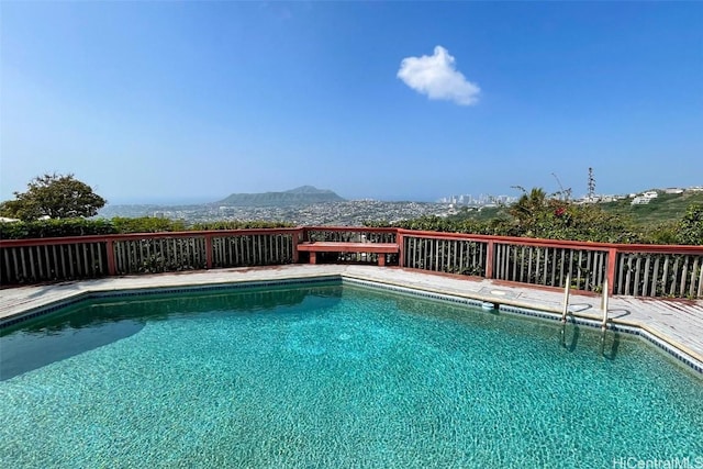 outdoor pool featuring a mountain view