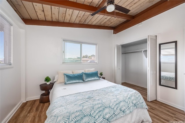 2445 Komo Mai Dr, Pearl City, HI 96782 - bedroom with wood ceiling, wood finished floors, beam ceiling, and a closet